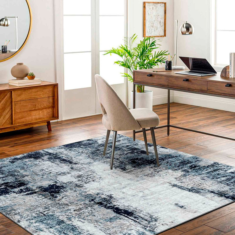 navy abstract rug in a room with matching decor