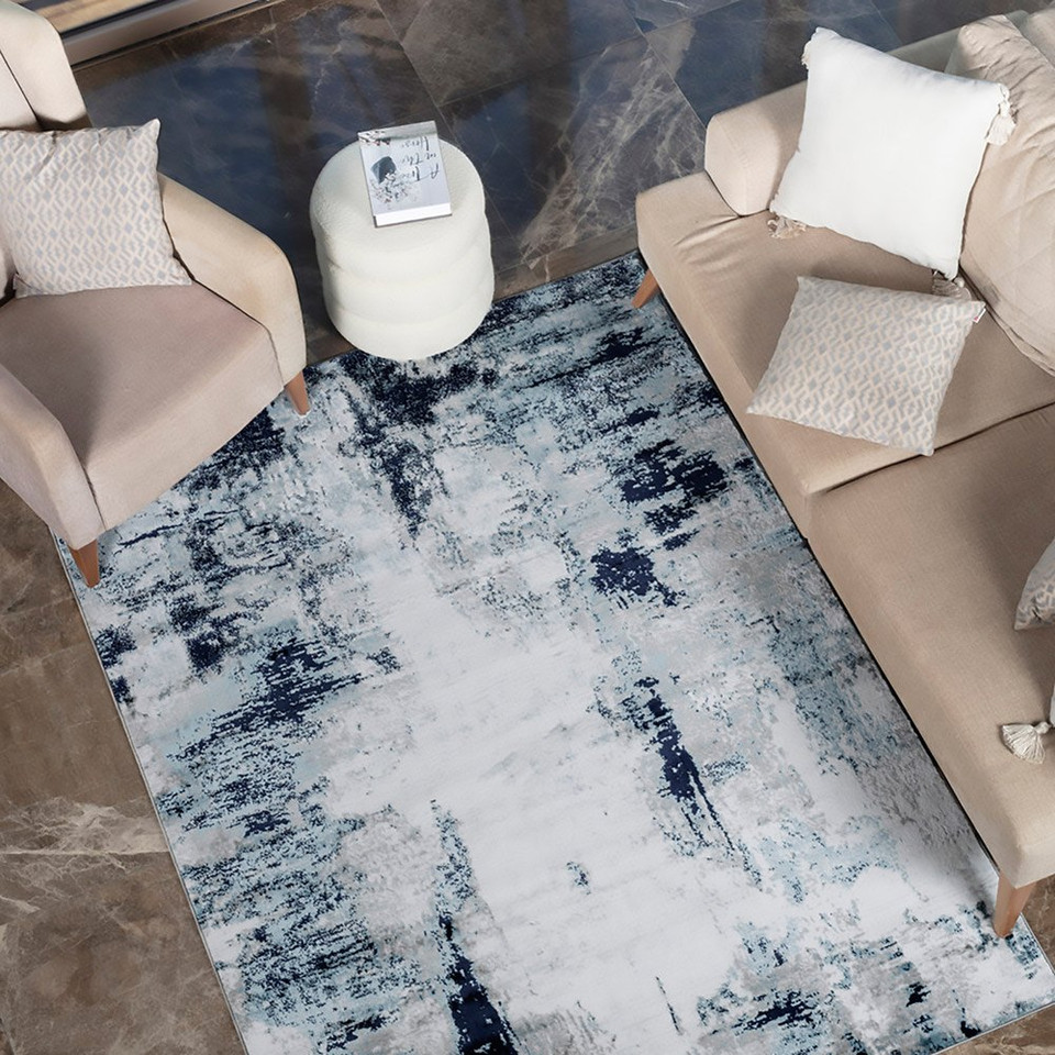 navy abstract rug in a room with matching decor