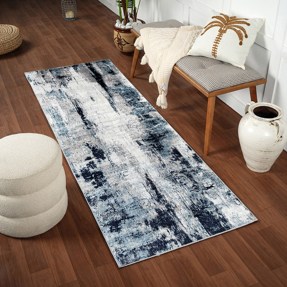navy abstract rug in a room with matching decor