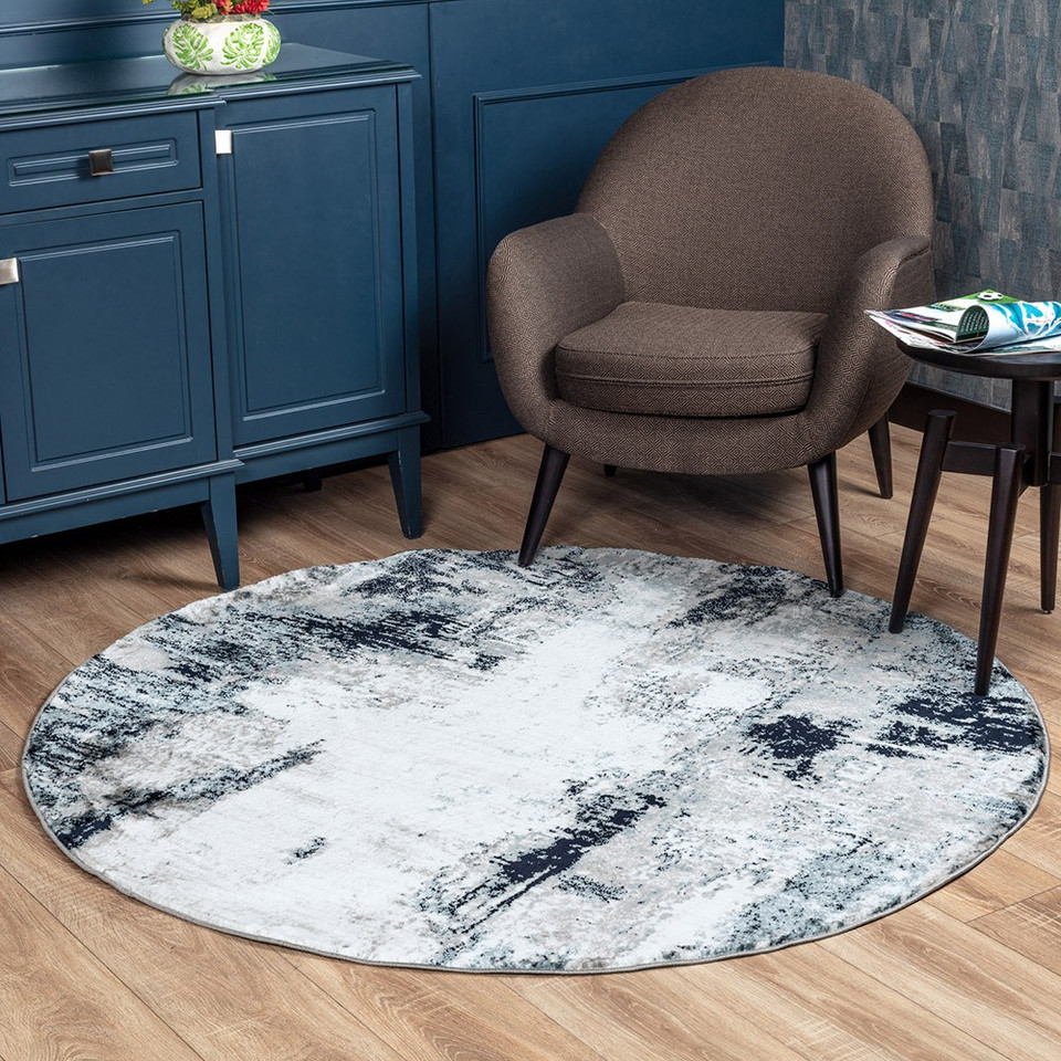 navy abstract rug in a room with matching decor