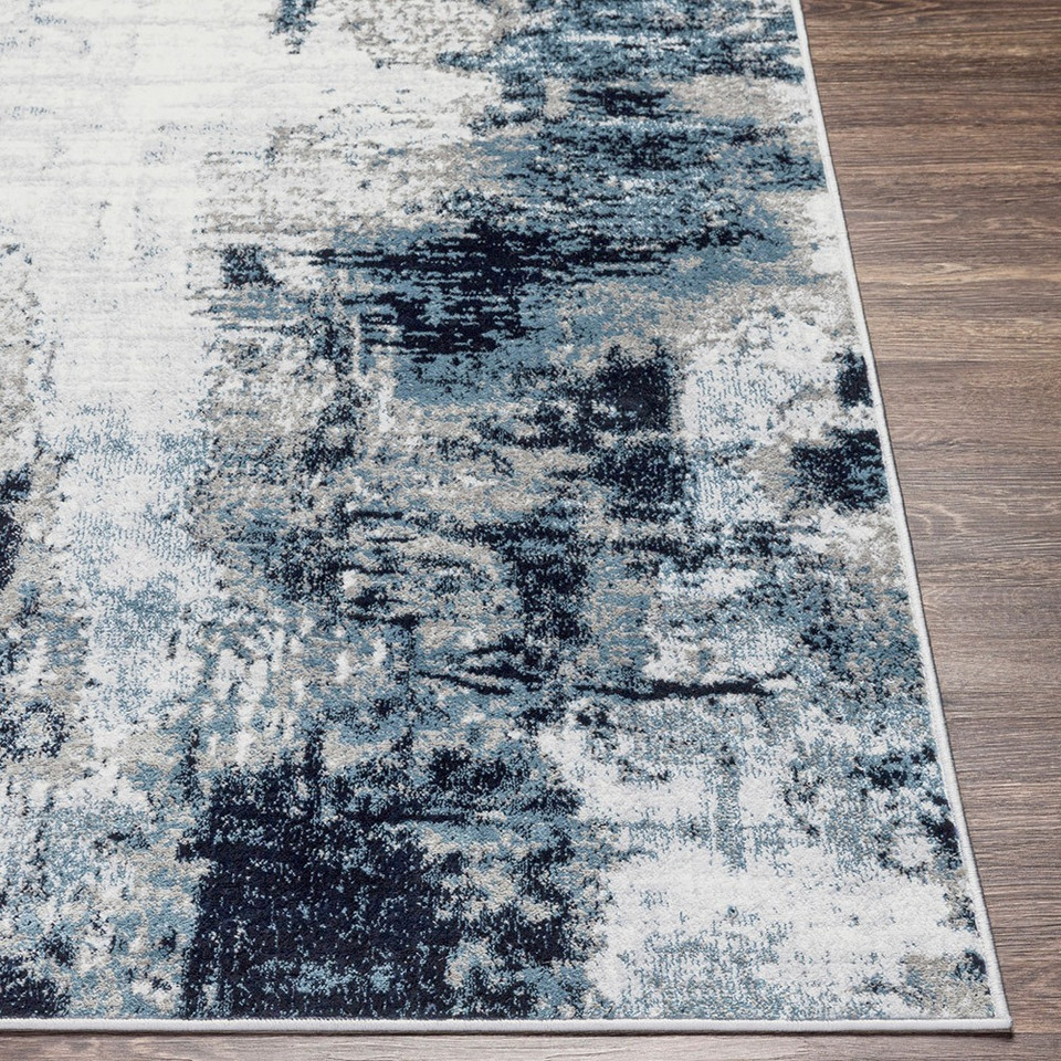navy abstract rug closeup corner on wood floor