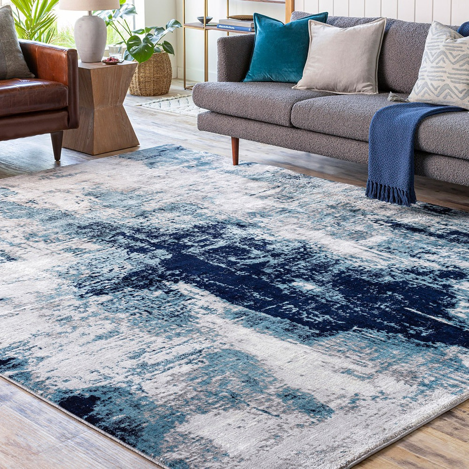 teal abstract rug in a room with matching decor