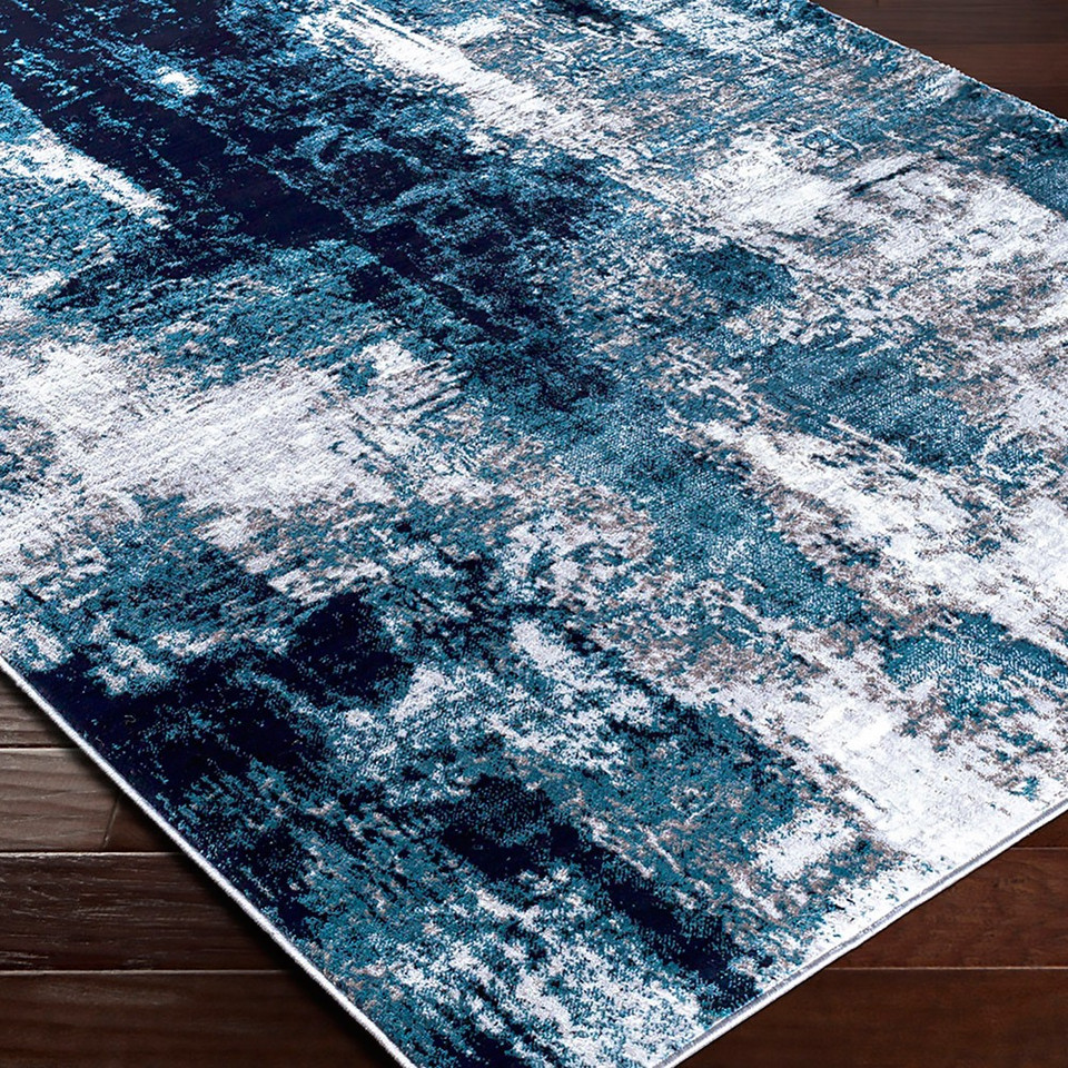 teal abstract rug closeup corner on wood floor