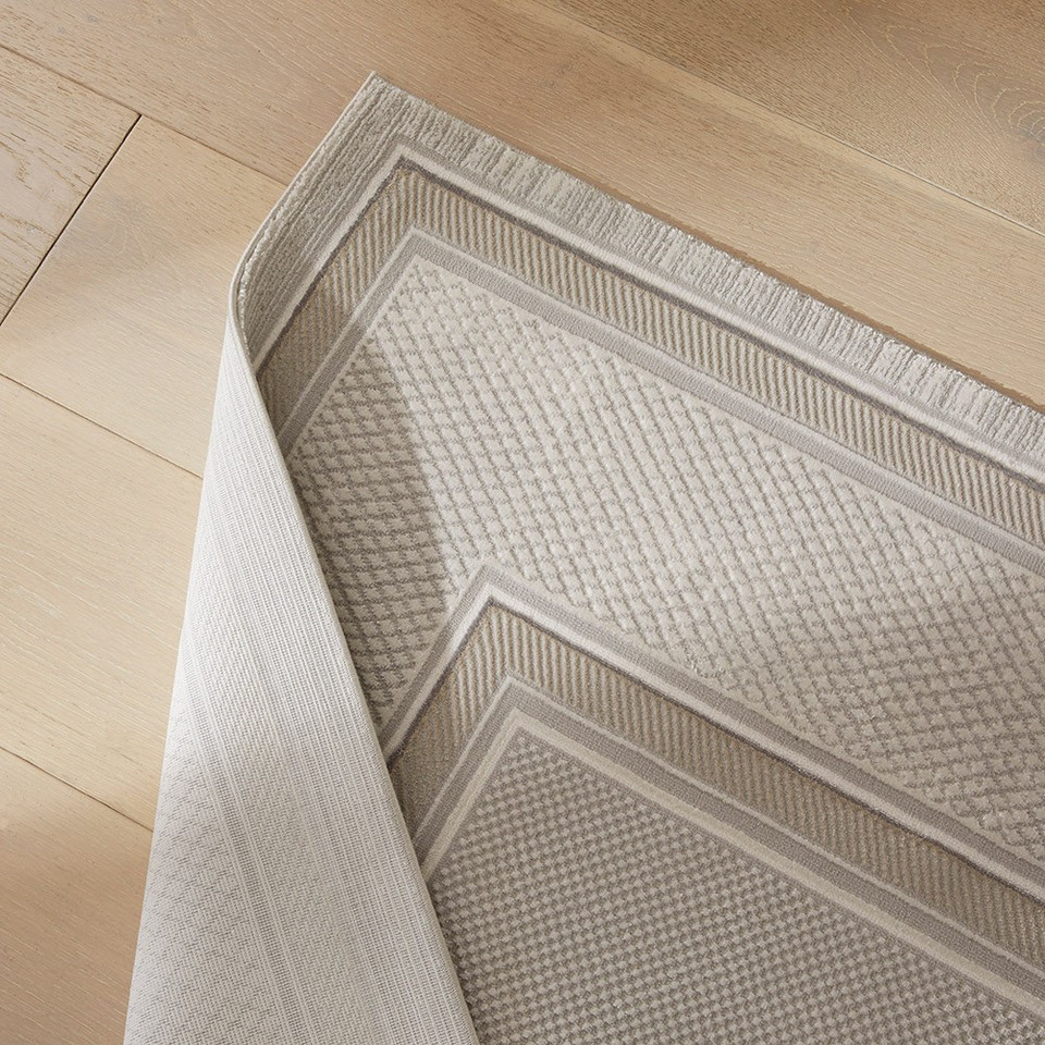 grey beige modern rug closeup fold