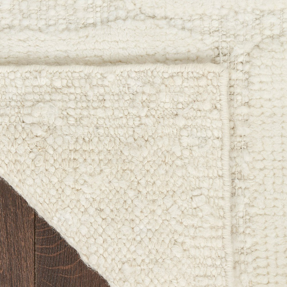 ivory wool rug corner fold