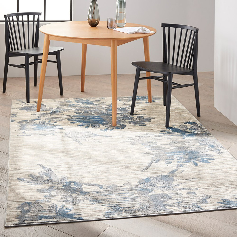 ivory grey blue calvin klein rug in a room with matching decor