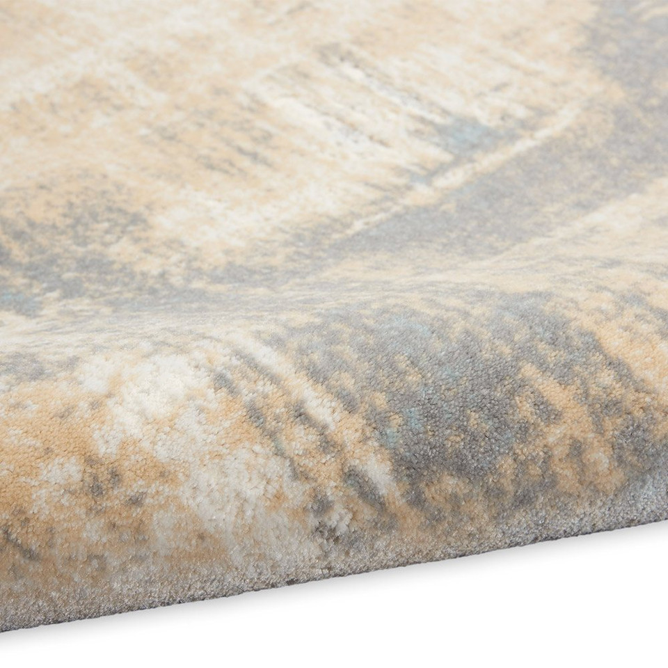 ivory seaglass calvin klein rug partially rolled on white floor