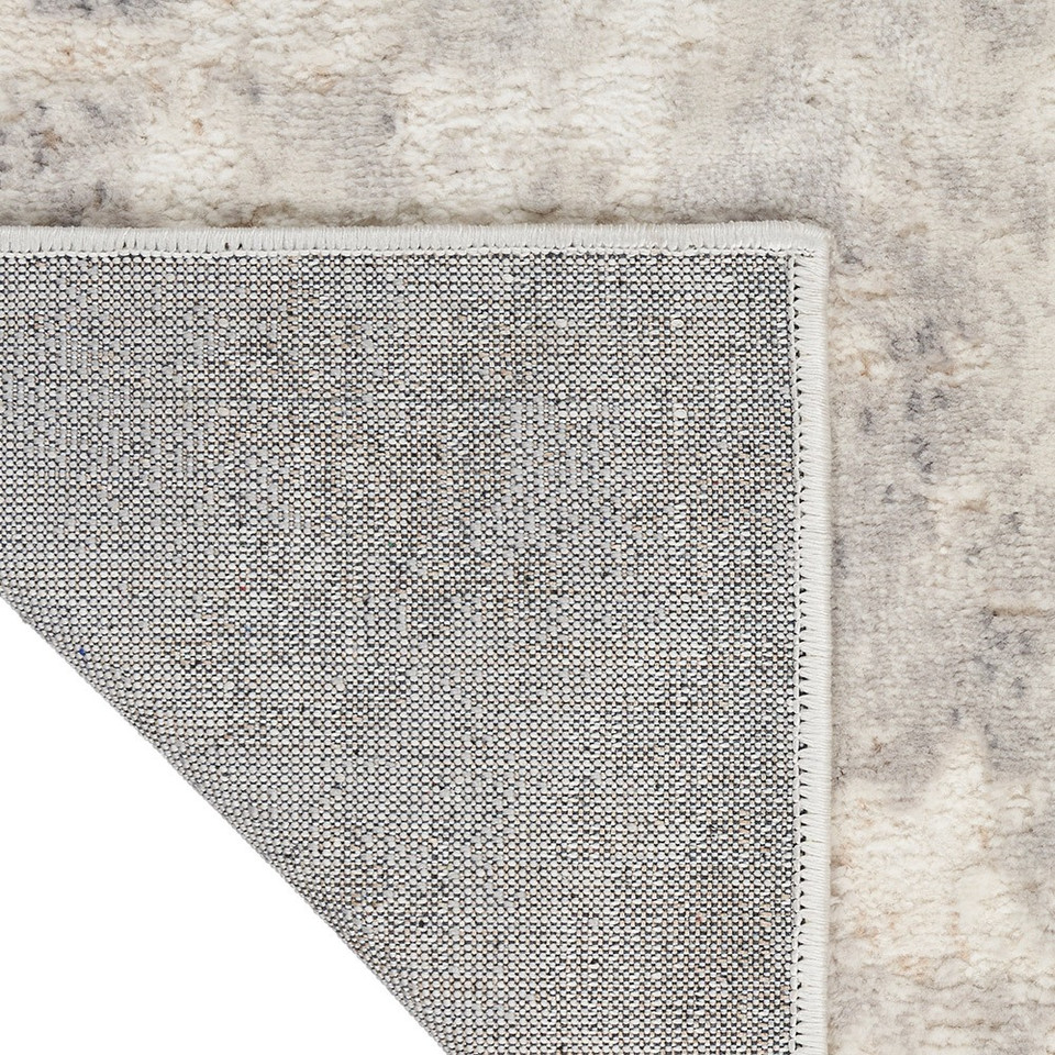ivory grey calvin klein rug corner fold on white background