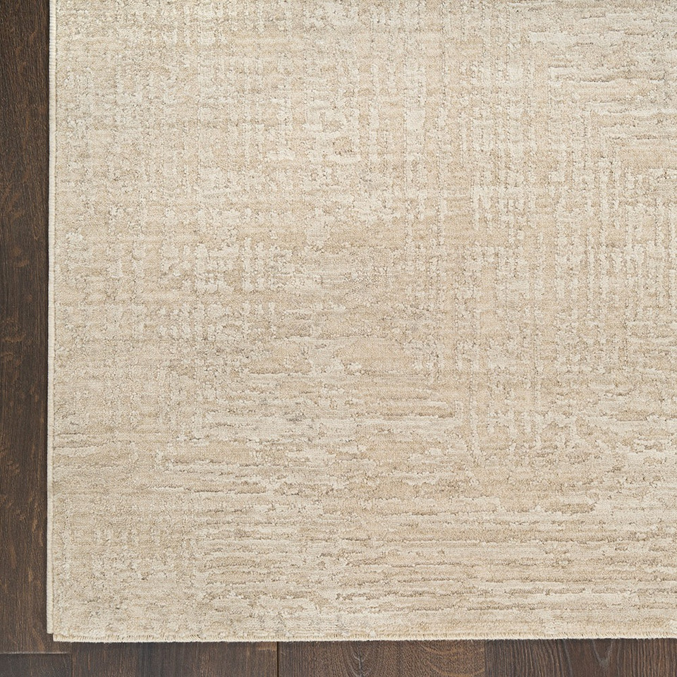 ivory beige abstract rug closeup corner on wood floor