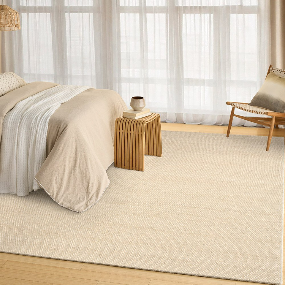 ivory beige rug in a room with matching decor