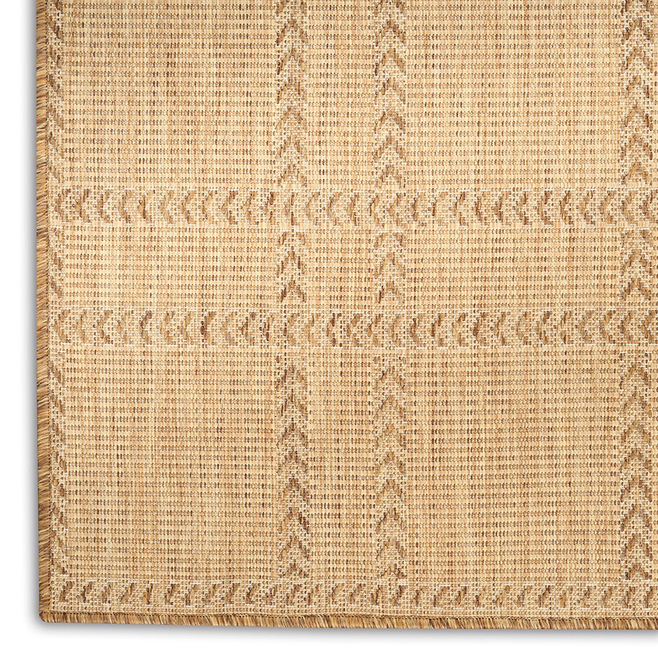 natural geometric indoor outdoor rug closeup corner on white background