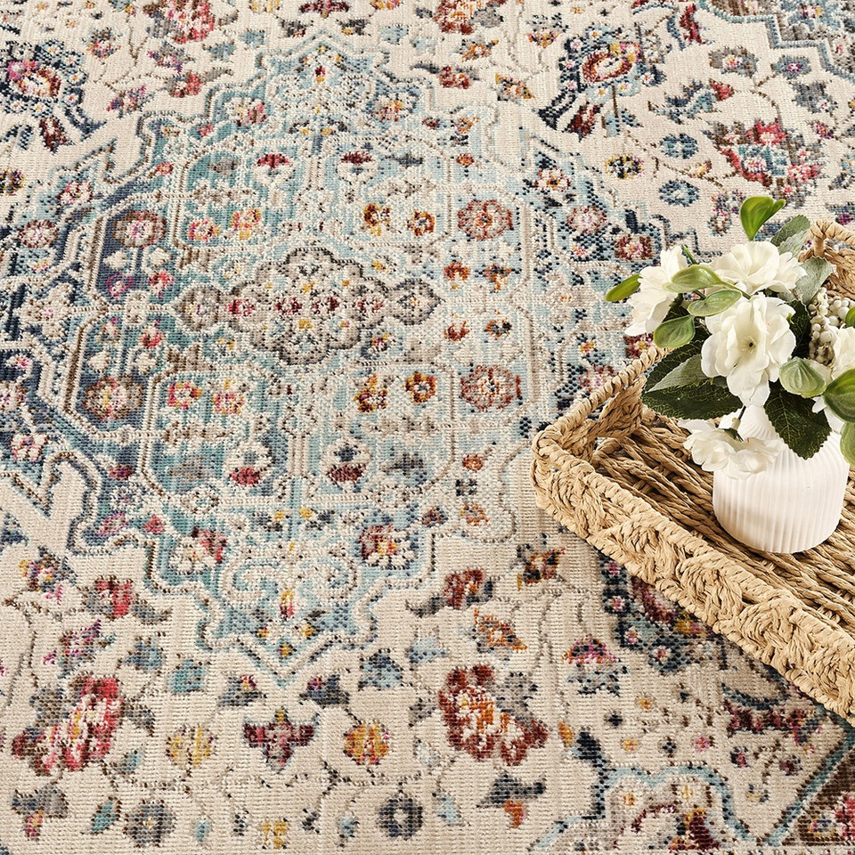 teal traditional rug closeup detail with basket with plant pot
