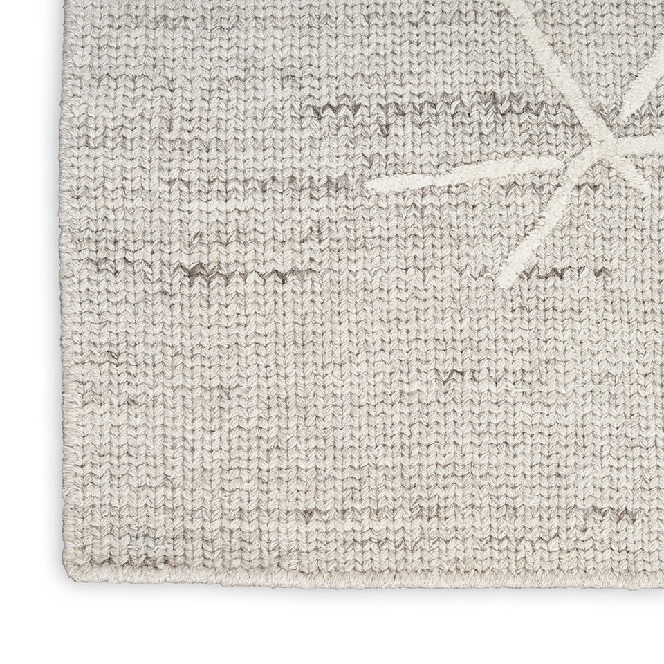grey calvin klein rug closeup corner on white background