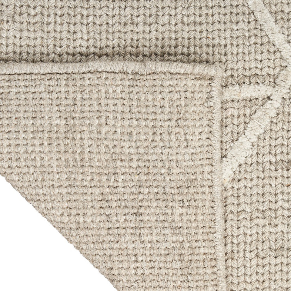 taupe calvin klein rug corner fold on white background