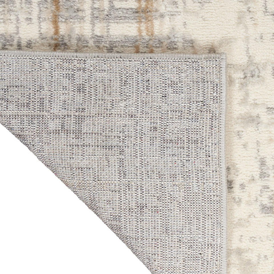 grey calvin klein rug corner fold on white floor