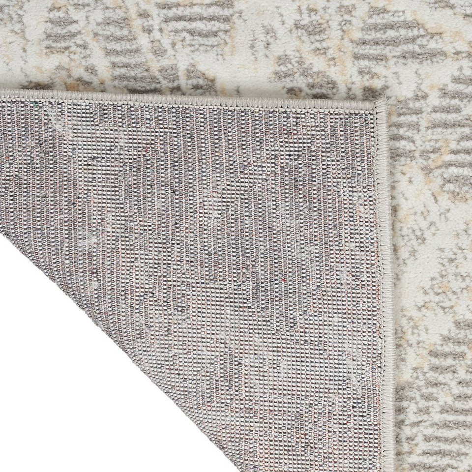 grey ivory calvin klein rug corner fold on white floor