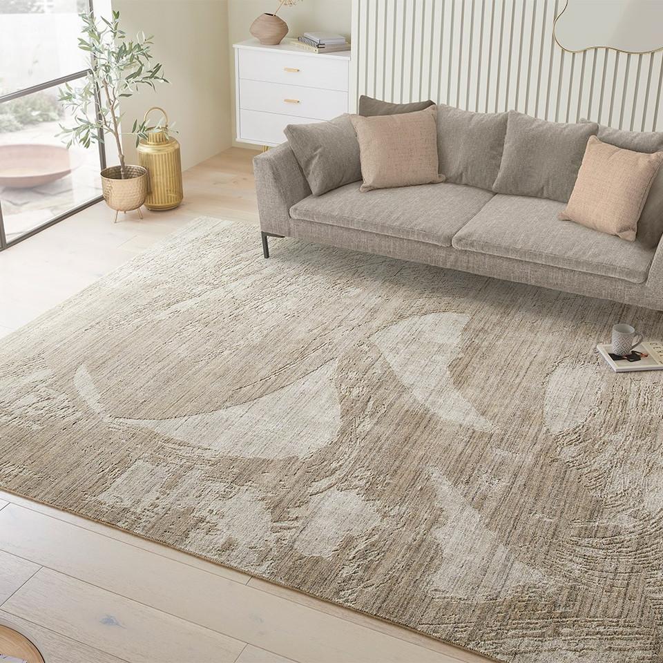 beige abstract rug in a living room with matching decor
