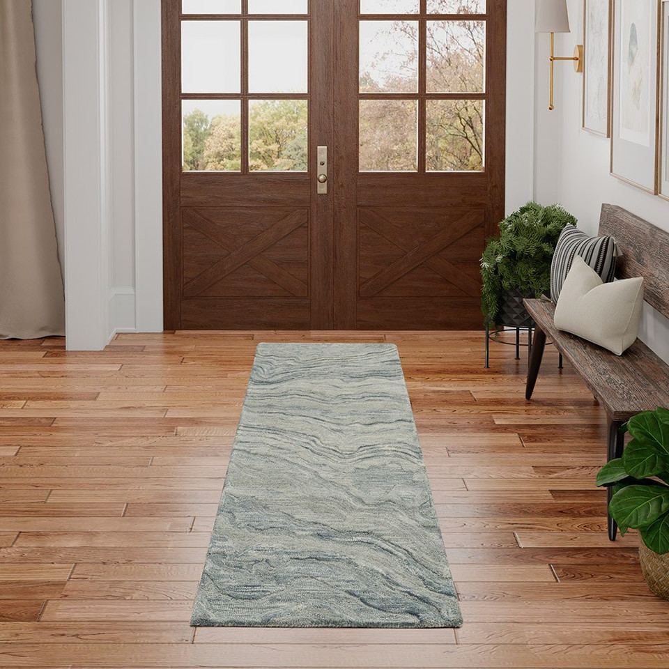 blue abstract rug in a room with matching decor