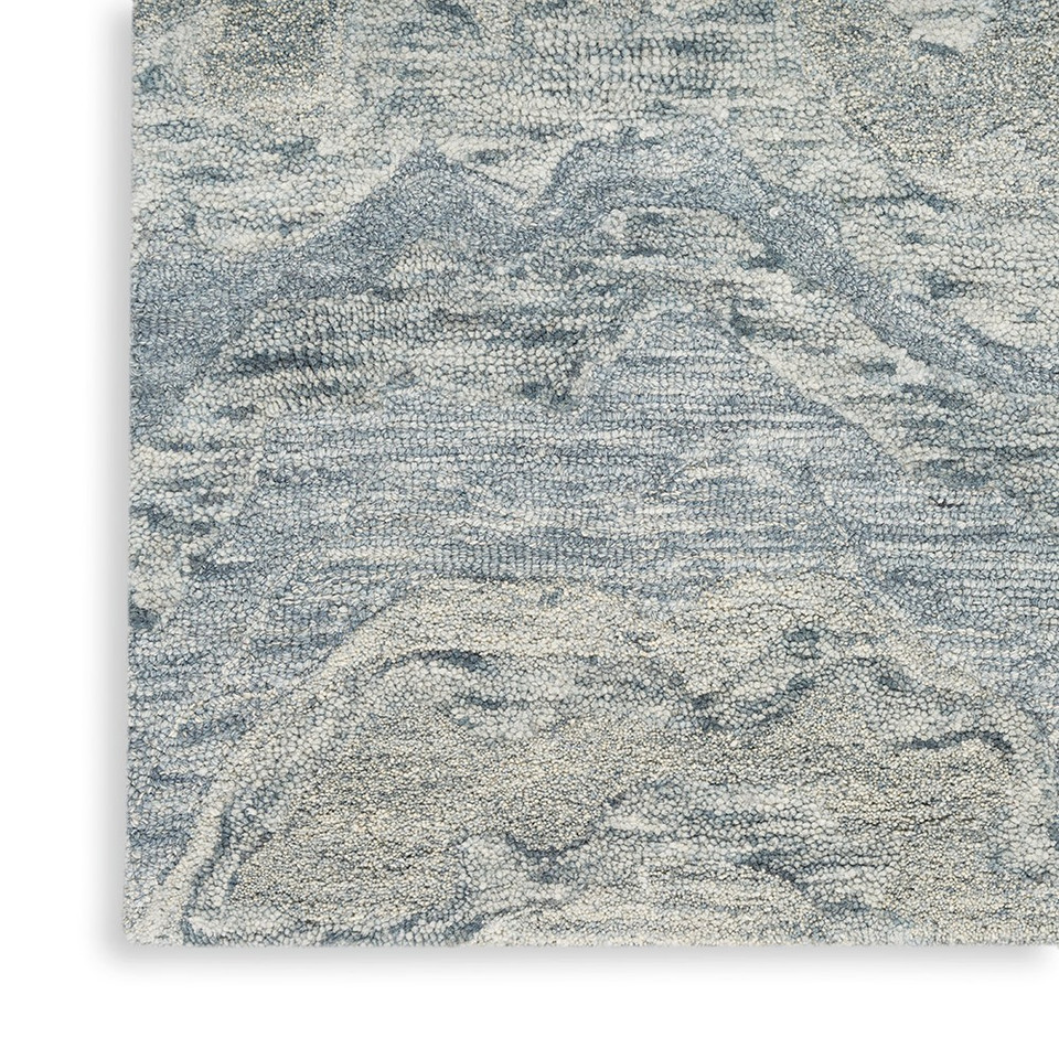 blue abstract rug closeup corner on white floor