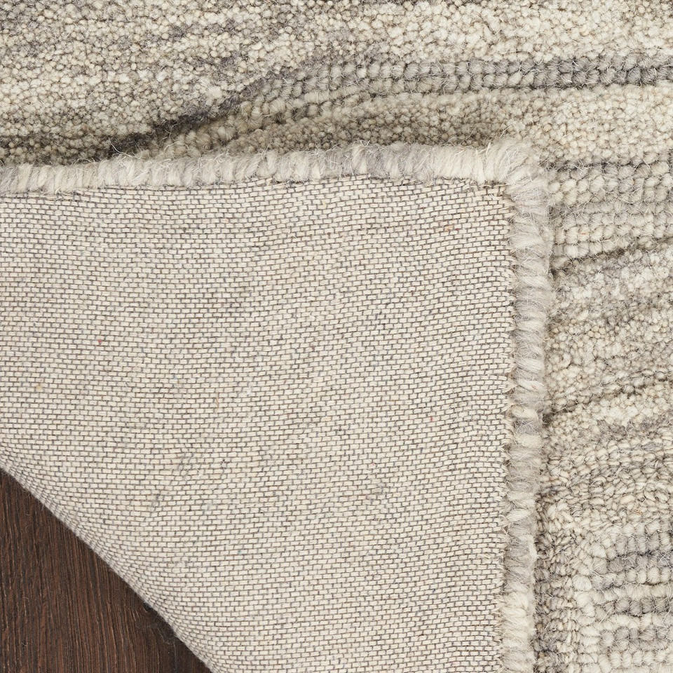 grey abstract rug closeup folded on white background