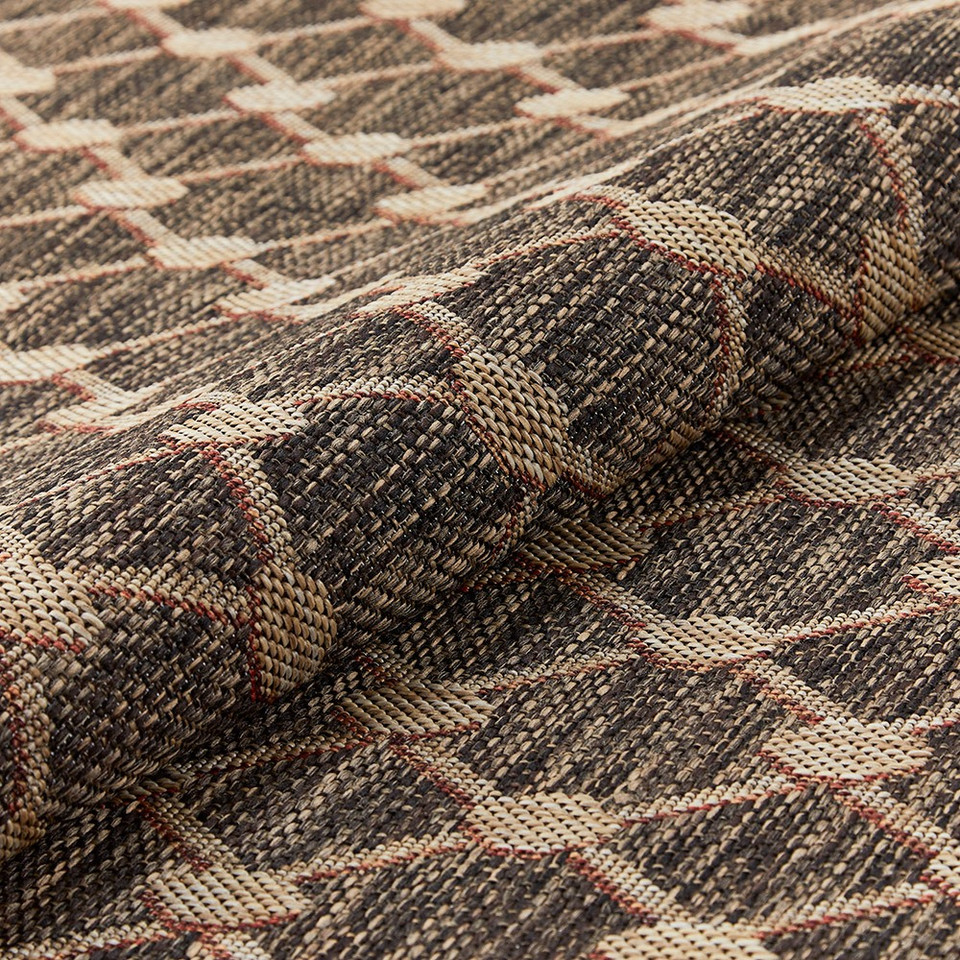 brown rug closeup partially rolled
