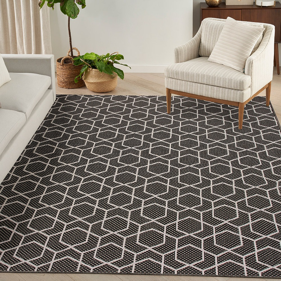 black geometric indoor outdoor rug in a room