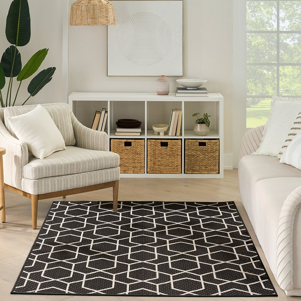 black geometric indoor outdoor rug in a room