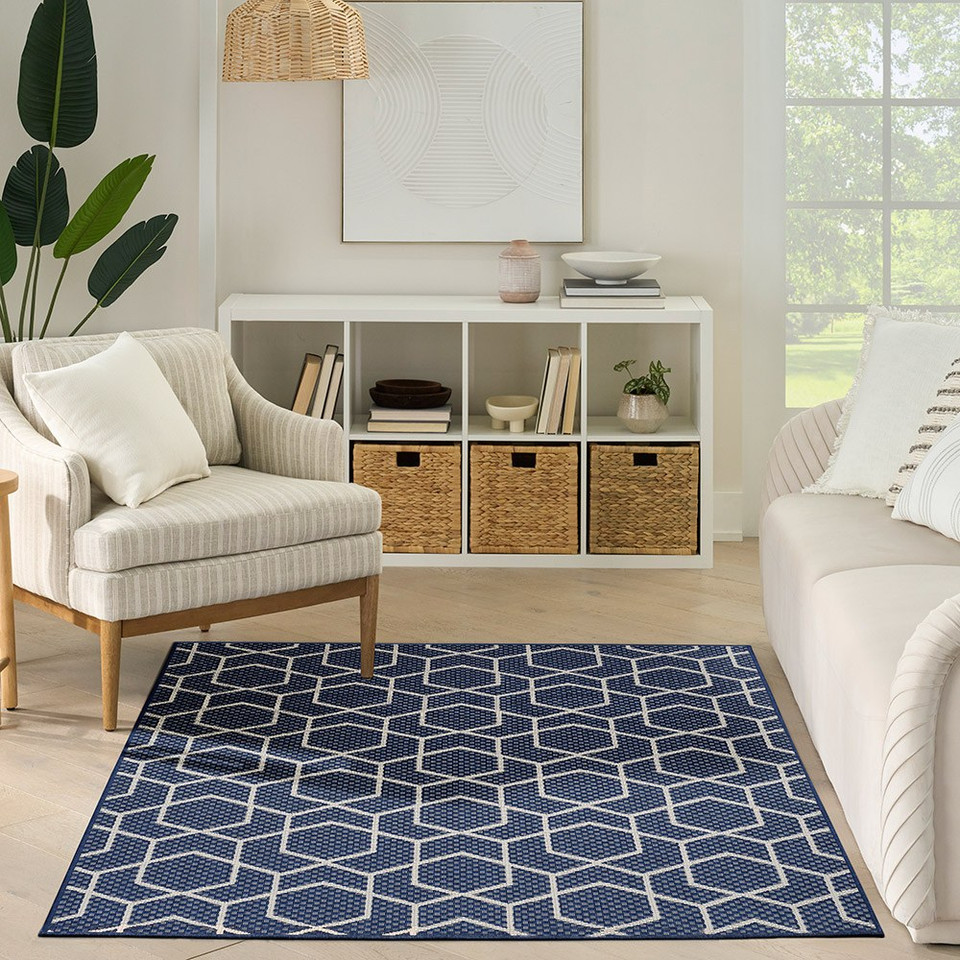 navy geometric indoor outdoor rug in a room