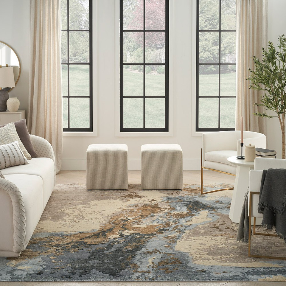 beige blue abstract rug in a room with matching decor