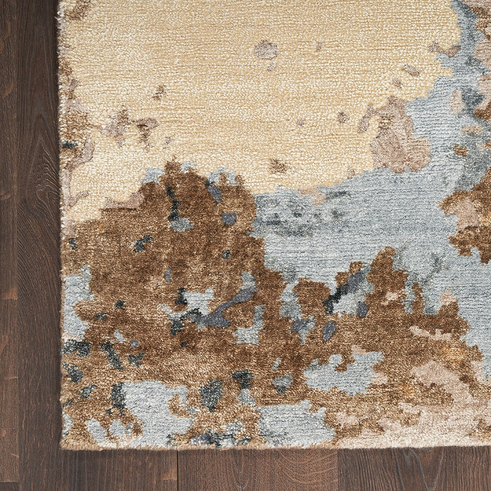 beige blue abstract rug closeup corner on wood floor