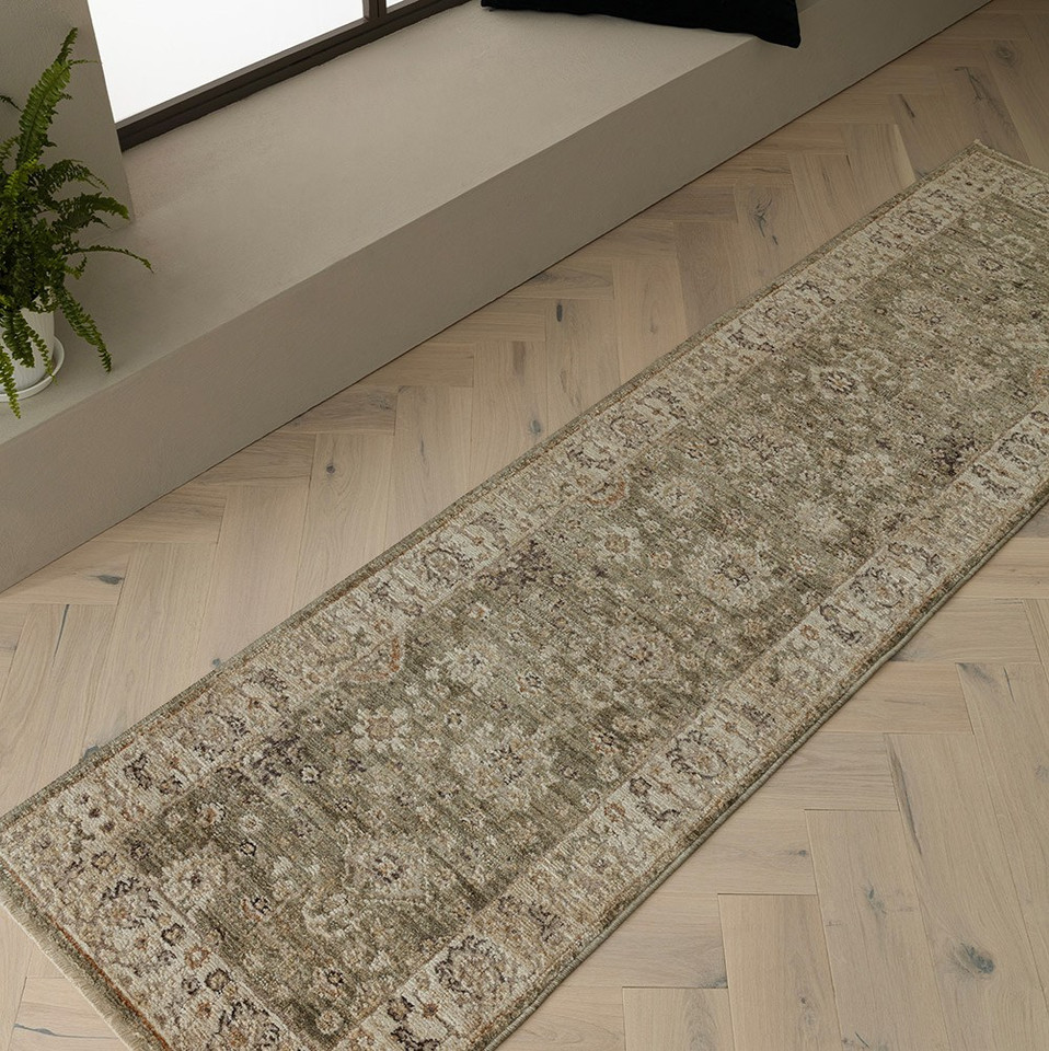green traditional rug in a living room with matching decor
