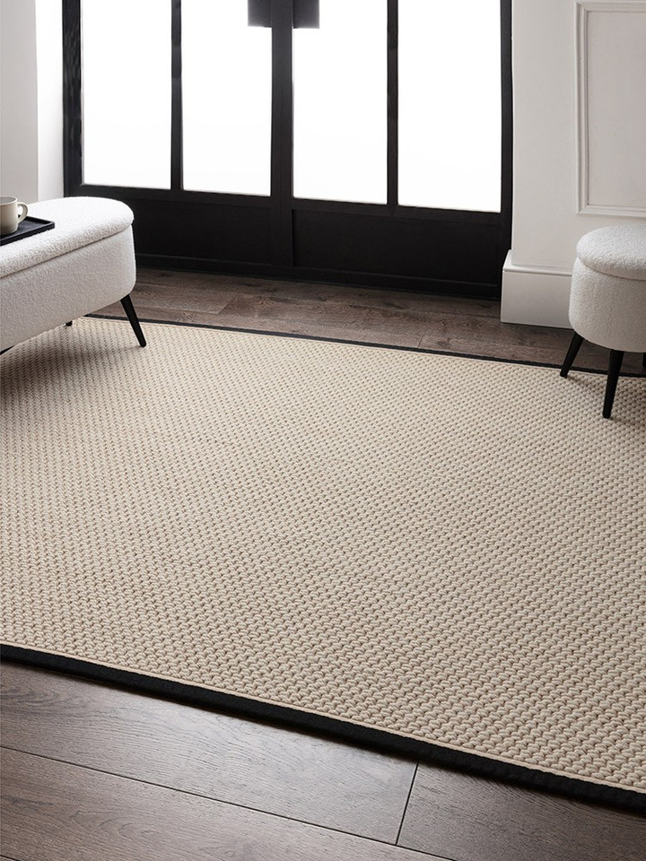 cream wool jute rug in a living room with matching decor