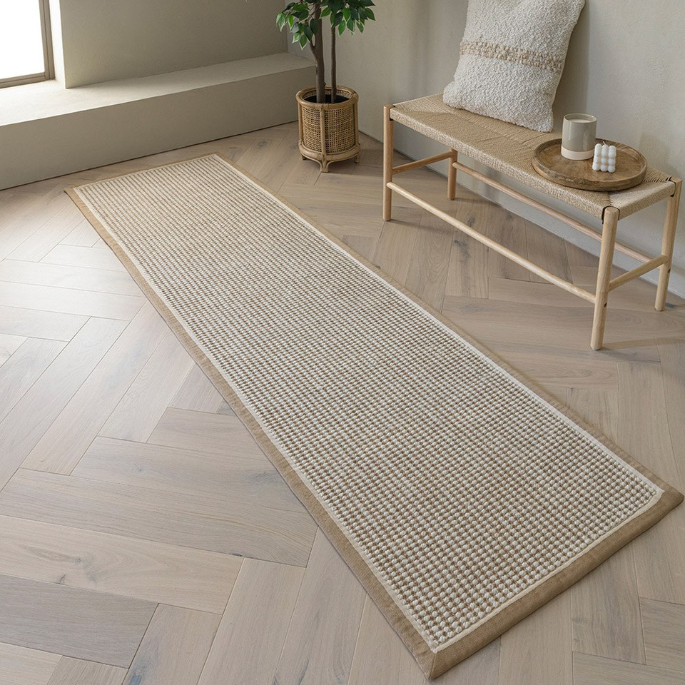 cream wool jute rug in a living room with matching decor