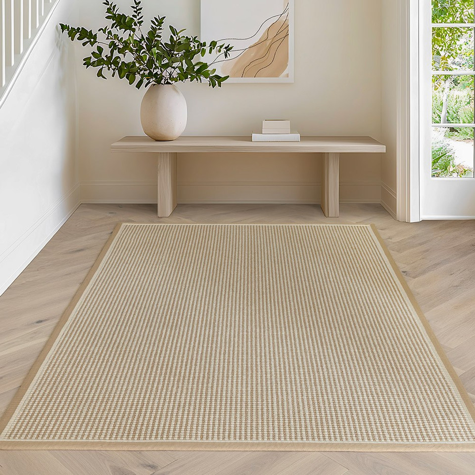 cream wool jute rug in a living room with matching decor