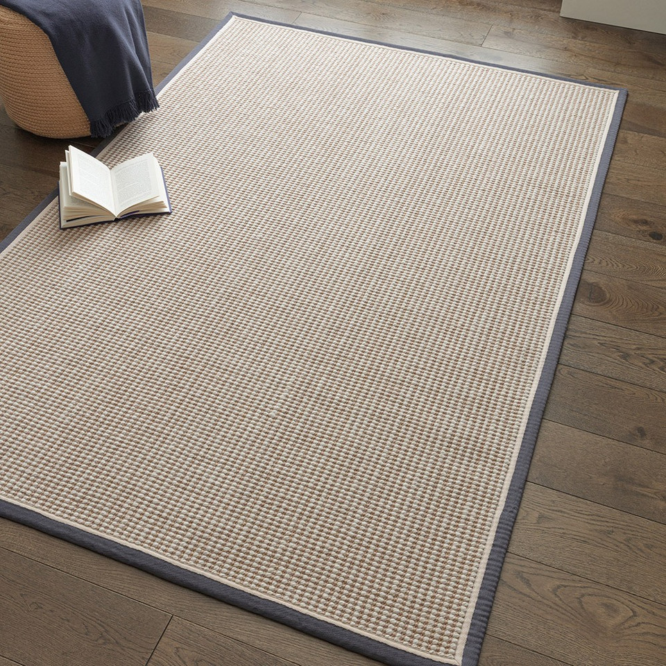 cream wool jute rug in a living room with matching decor