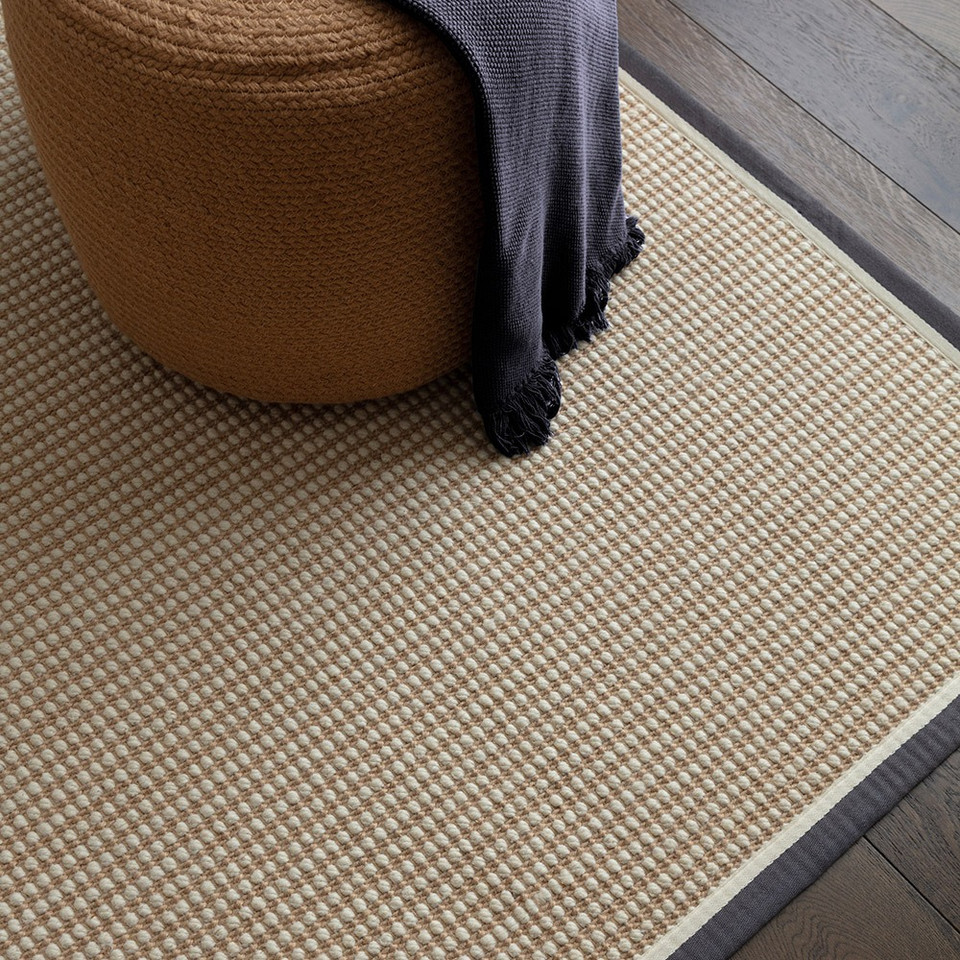 cream wool jute rug in a living room with matching decor
