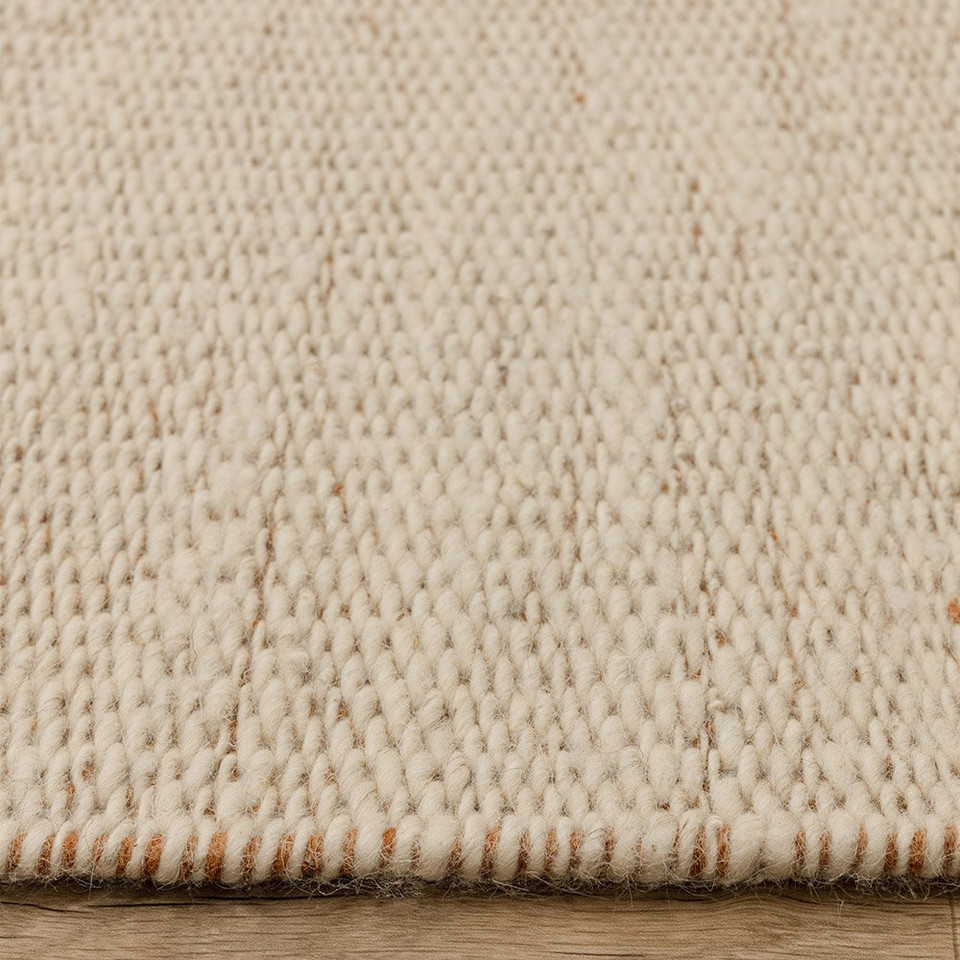 rust flatweave wool rug closeup border