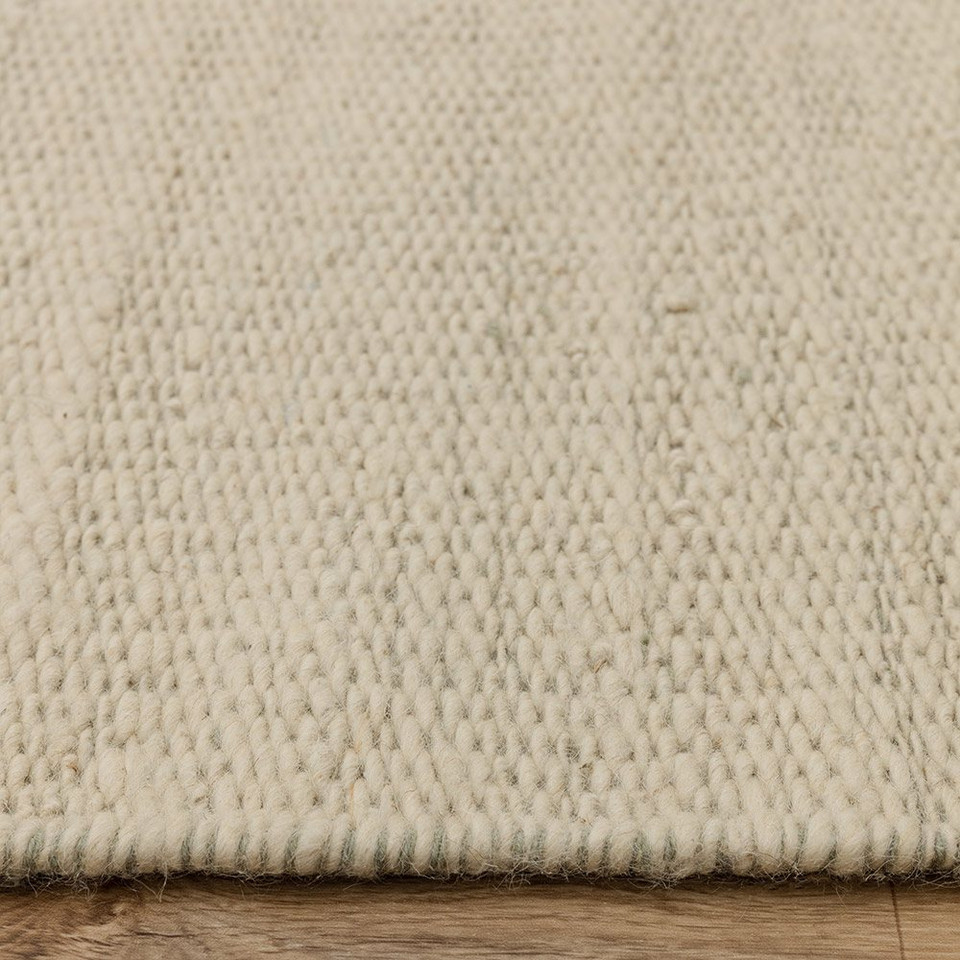 sage flatweave wool rug closeup border