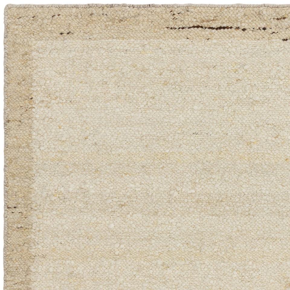 beige wool rug closeup corner