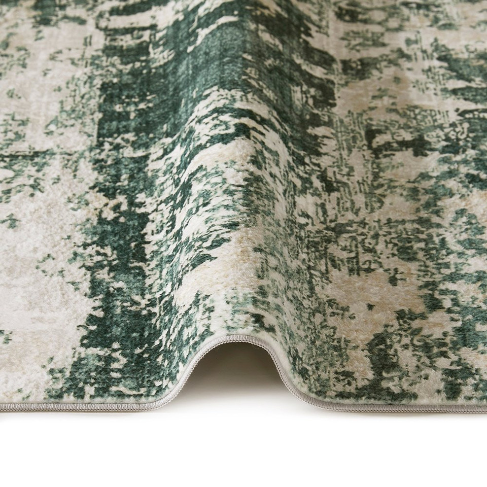 ivory olive abstract rug closeup fold on white floor