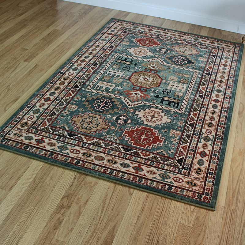 https://cdn11.bigcommerce.com/s-59ie76my1z/products/21605/images/116225/9x5_tribal_green_wool_rug_on_floor_6__93422__16476__60531.1657195611.1280.1280.jpg?c=1