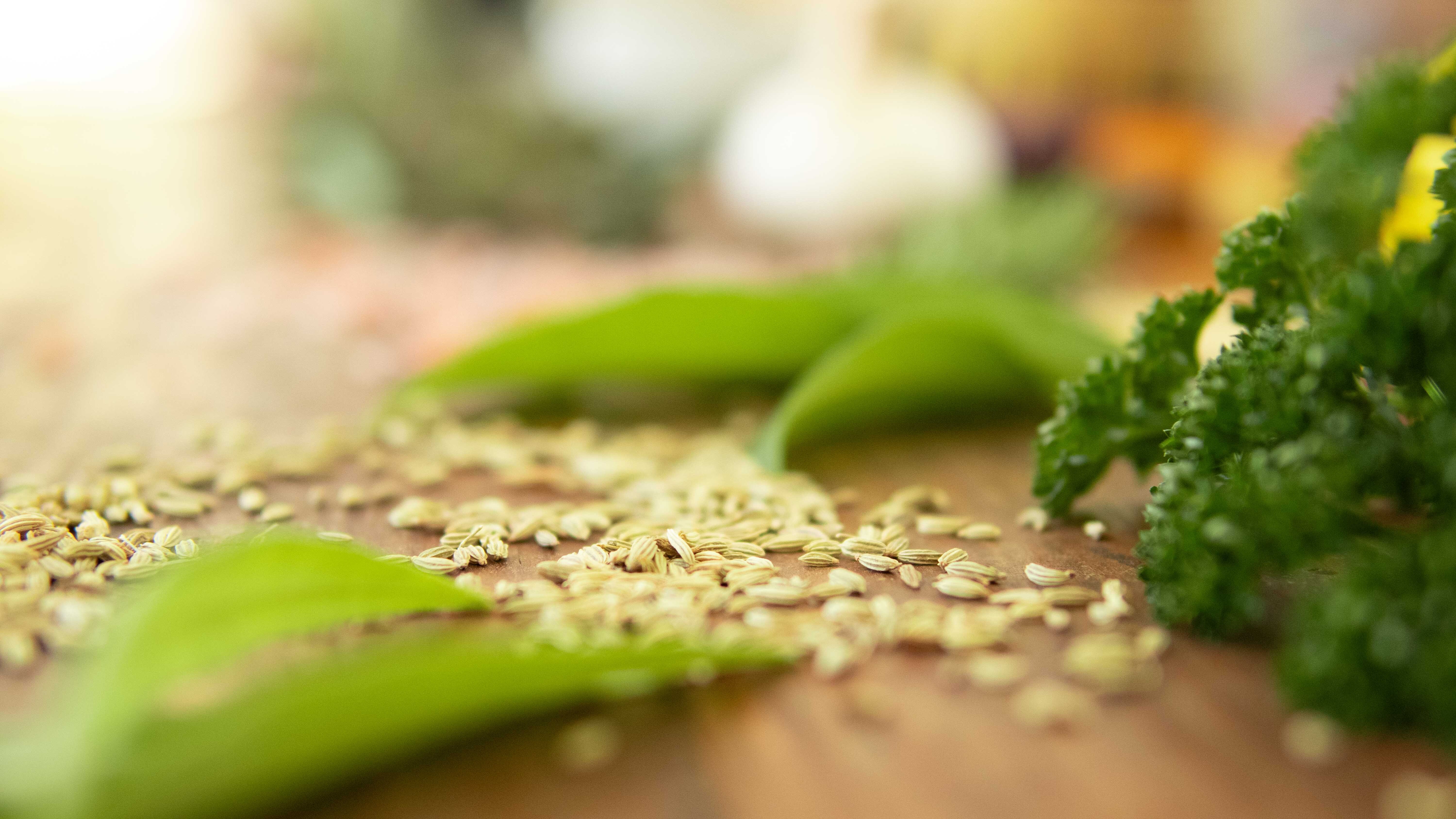 Bulk herbs, spices and teas laid out on a wooden table - wholesale supplier Australia