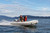 Achilles HB-310AL rigid hull inflatable boat with Honda outboard.