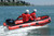 Achilles FRB-124 Sport Utility inflatable boat with outboard in action.