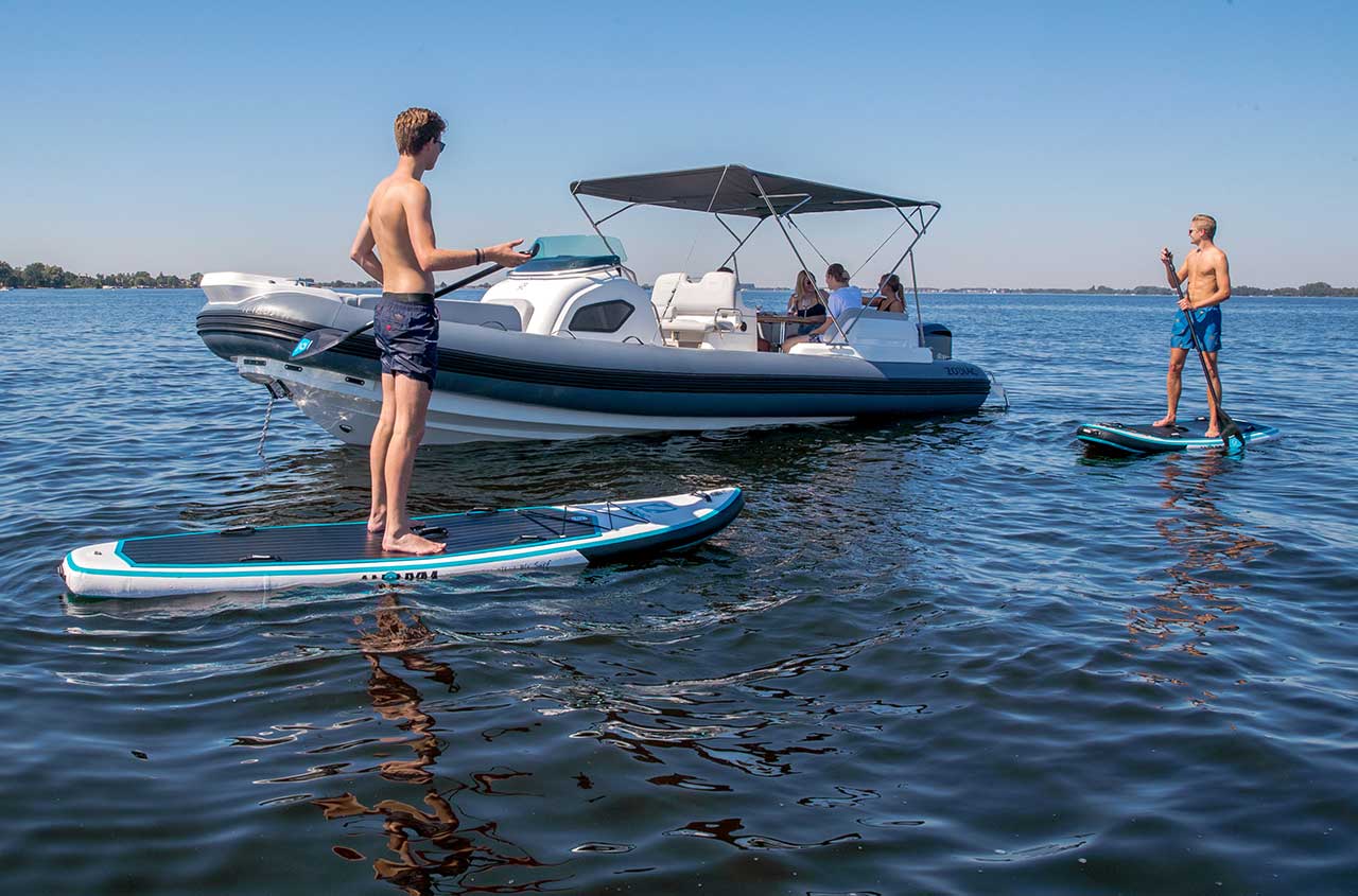 Fishing Inflatable Rubber Boat Standing On The Shore Of Lake