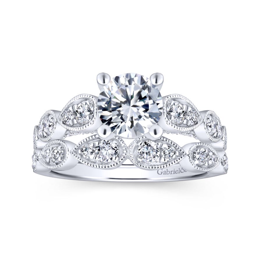 vintage-inspired diamond wedding ring with pear-shaped milgrain detailing