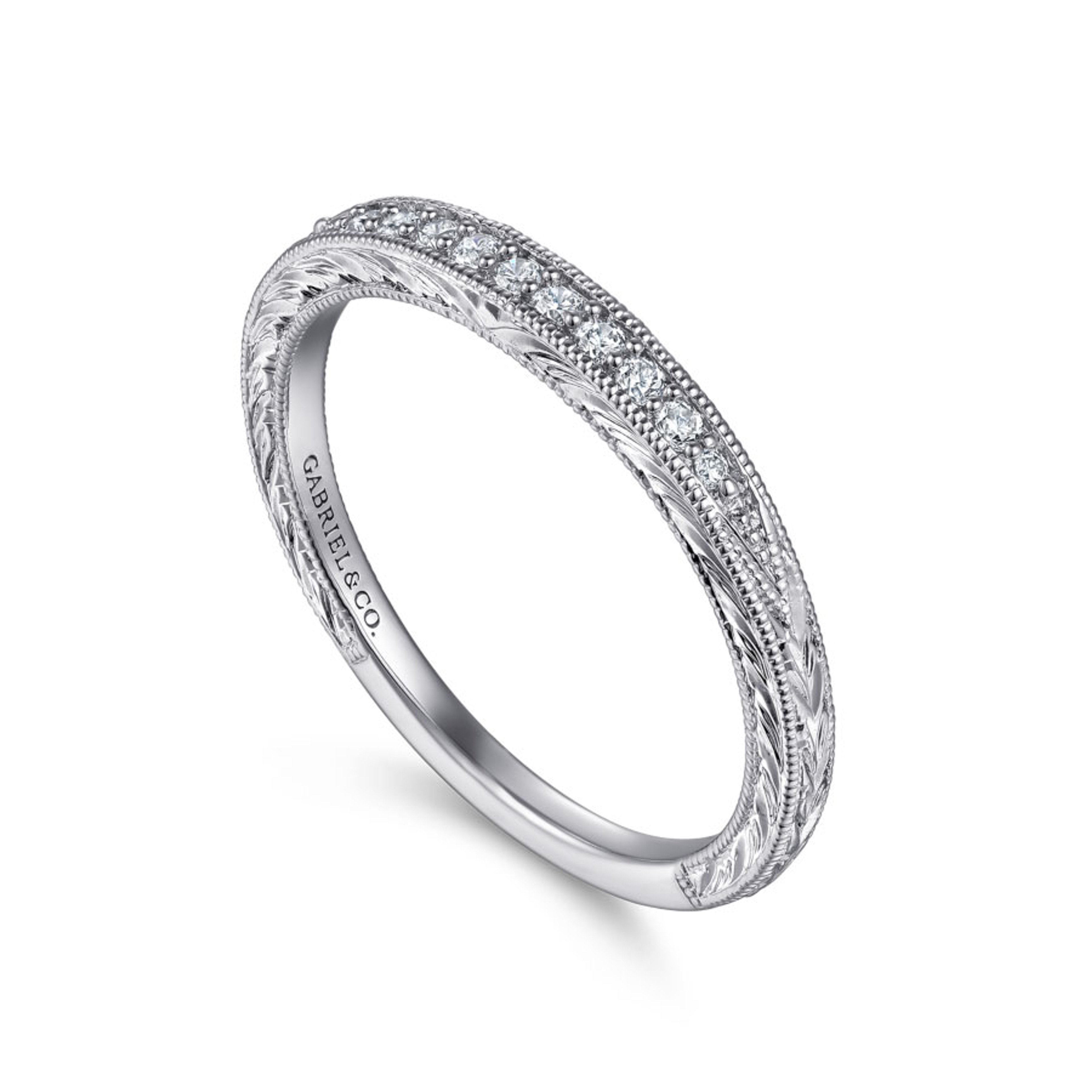 vintage-inspired wedding ring with channel set diamonds and milgrain detailing