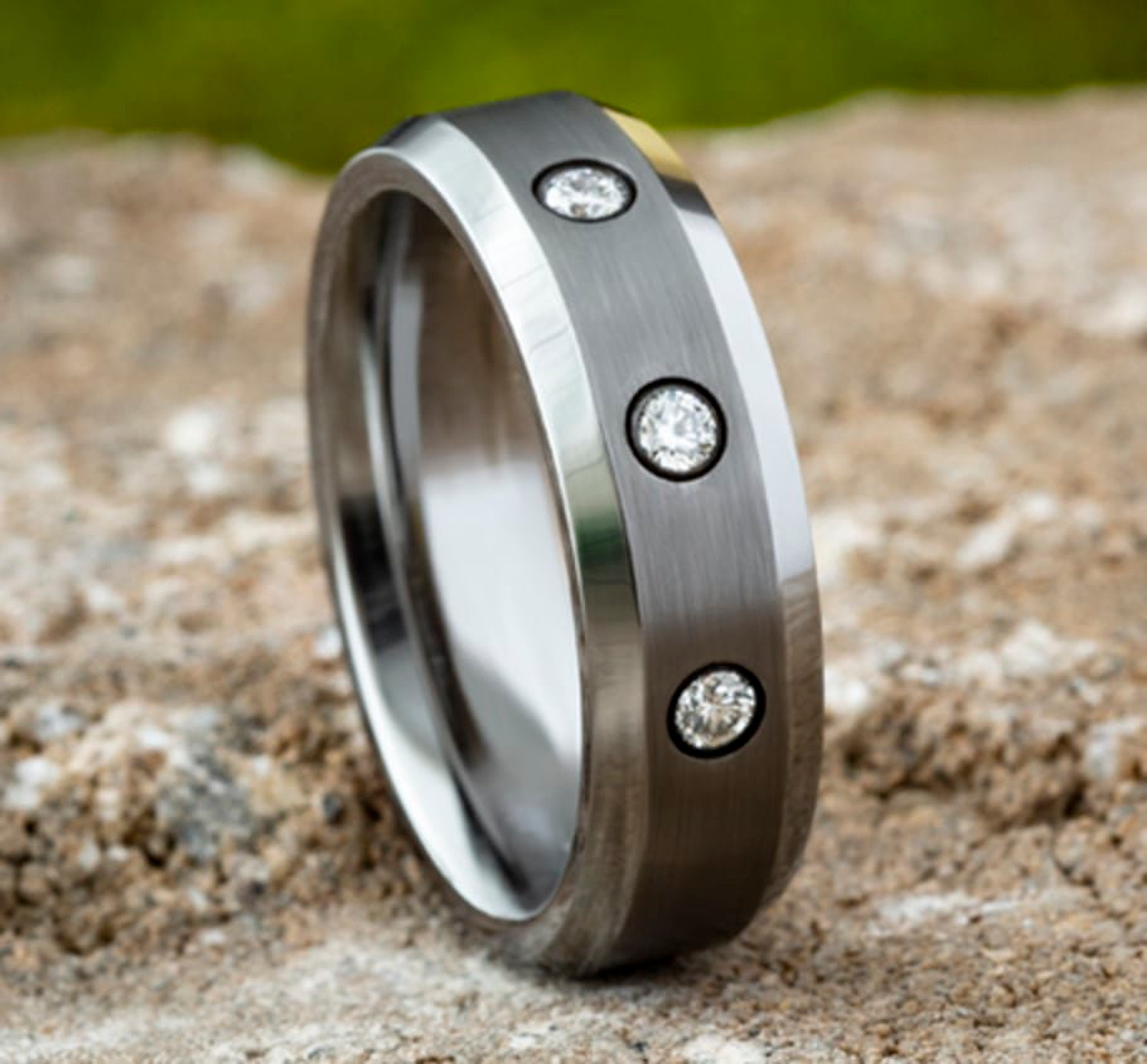 tungsten wedding ring with gypsy-set diamonds and a satin finish