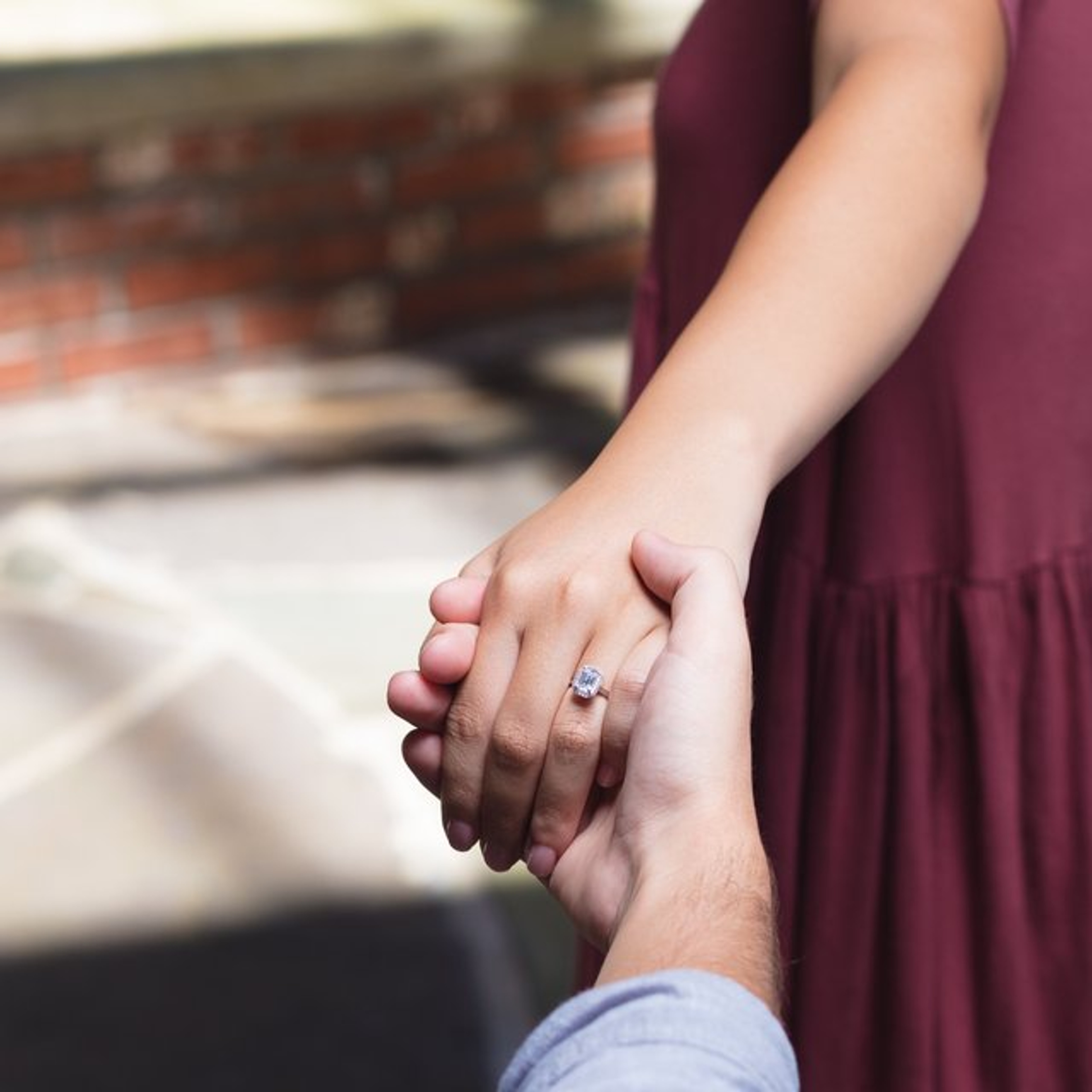 halo engagement ring with plain band and hidden diamond detail