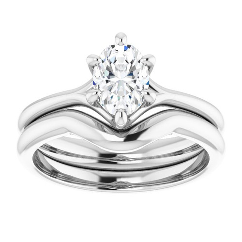 14K white gold solitaire engagement ring with oval moissanite center stone and polished band with matching polished wedding ring